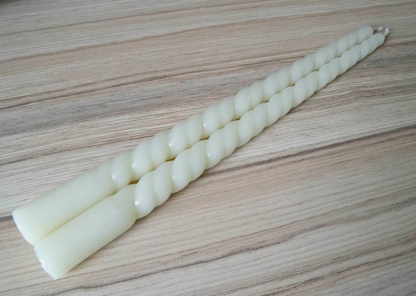 This is a picture of Homemade Dripless Beeswax Spiral Taper Candles