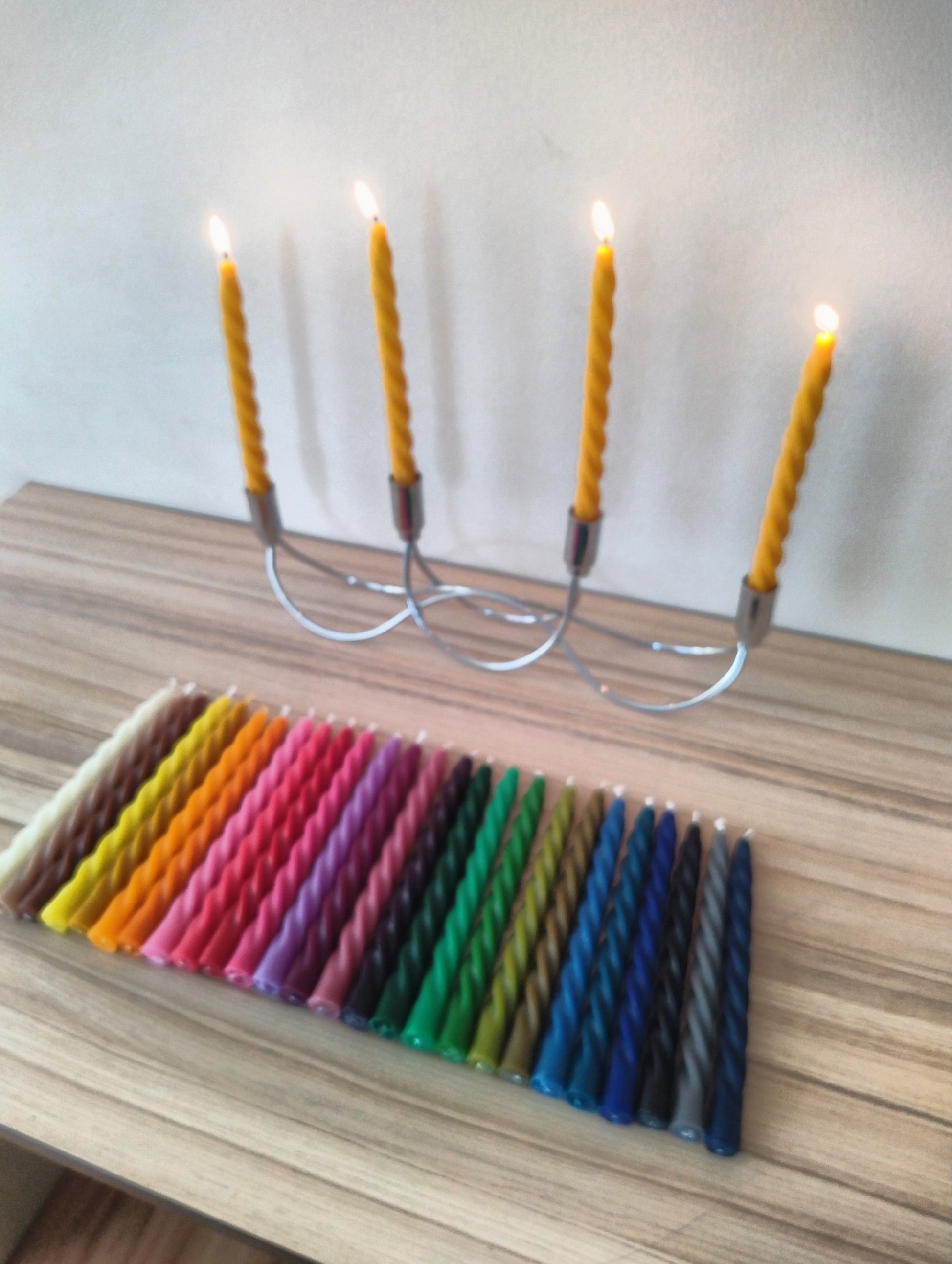 This is a picture of Handmade Colorful Beeswax Twisted Taper Candles 