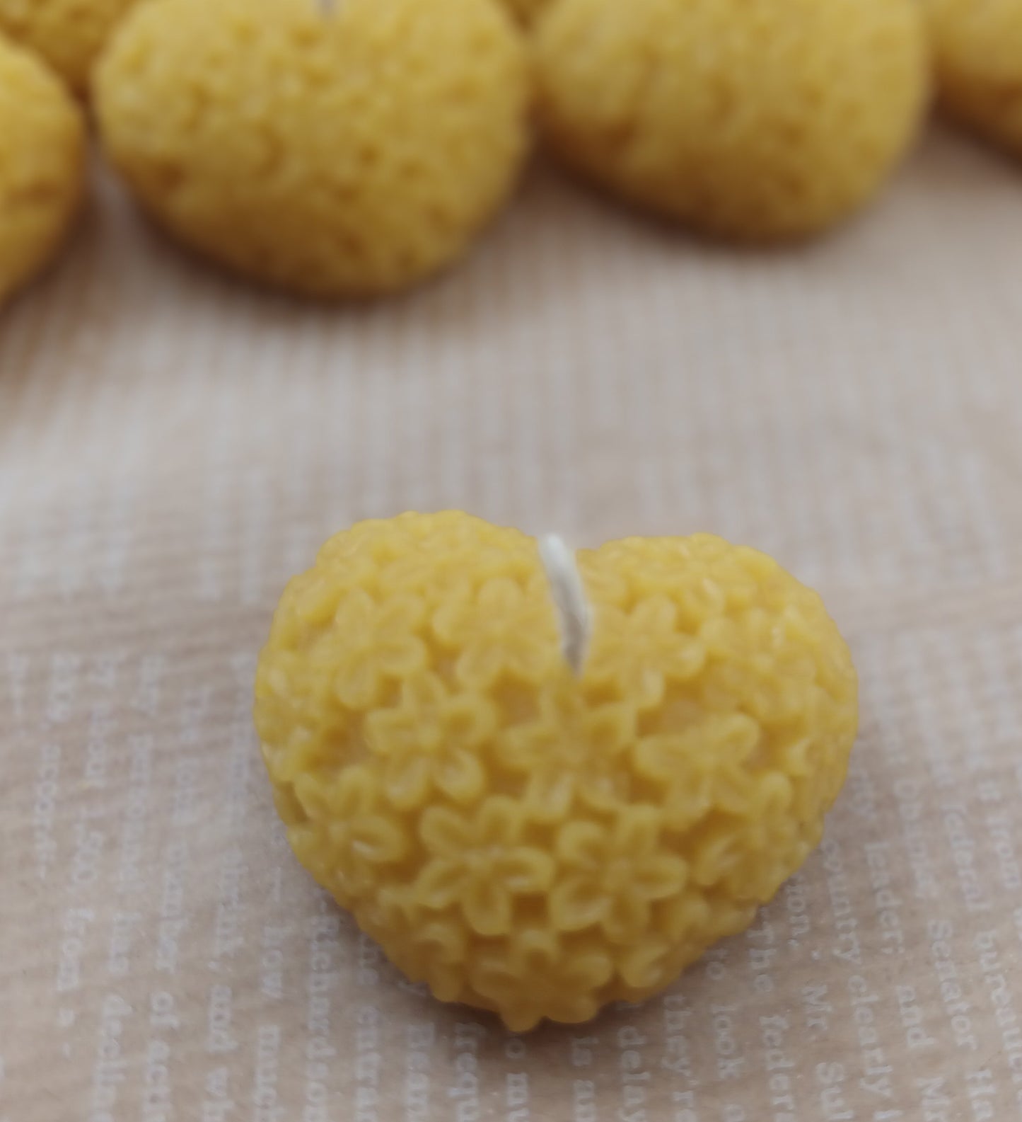 This is a picture of Beeswax Heart Tealights - Natural Color